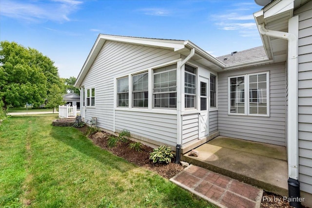 40 S Juniper Dr, North Aurora, IL 60542 - view of property exterior featuring a yard