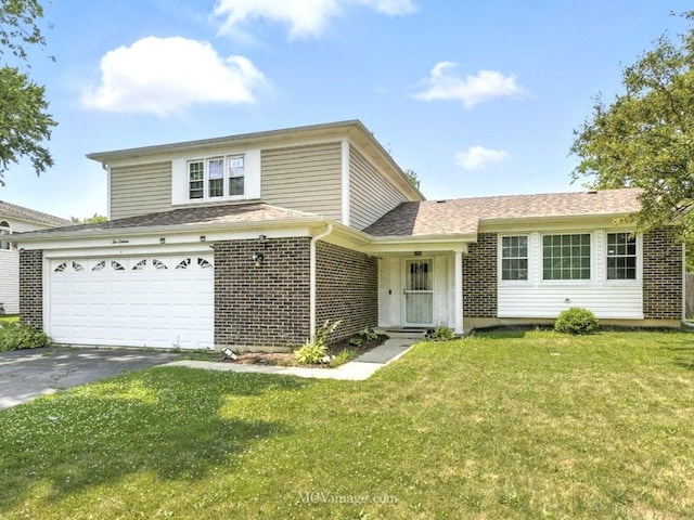 216 Cheshire Ct, Bolingbrook, IL 60440 - traditional-style house featuring brick siding, asphalt driveway, and a front yard