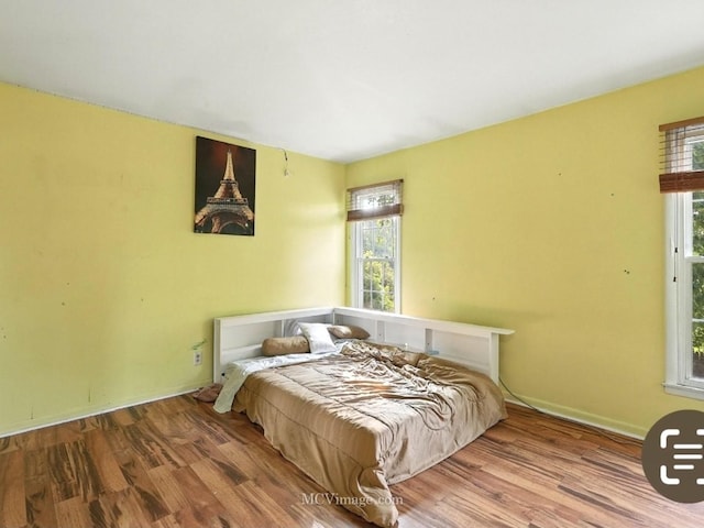 216 Cheshire Ct, Bolingbrook, IL 60440 - bedroom with wood finished floors and multiple windows