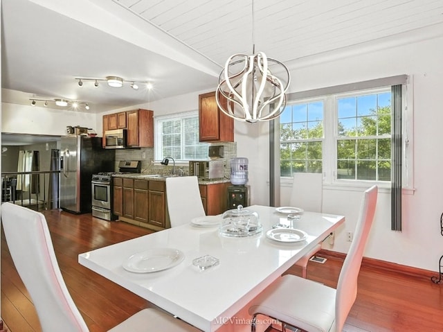 216 Cheshire Ct, Bolingbrook, IL 60440 - dining room featuring dark wood-type flooring and a chandelier