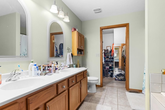 3792 Foxglove Ln, Winnebago, IL 61088 - bathroom with double vanity, tile patterned floors, and a spacious closet