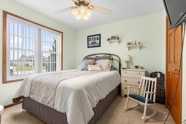 3792 Foxglove Ln, Winnebago, IL 61088 - bedroom with multiple windows, light carpet, and ceiling fan