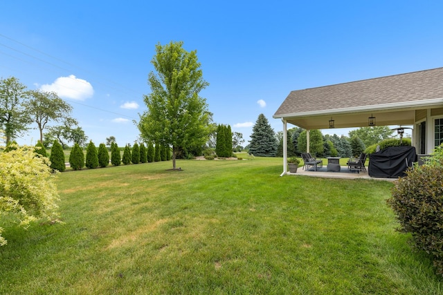 3792 Foxglove Ln, Winnebago, IL 61088 - view of green lawn featuring a patio area and an outdoor fire pit