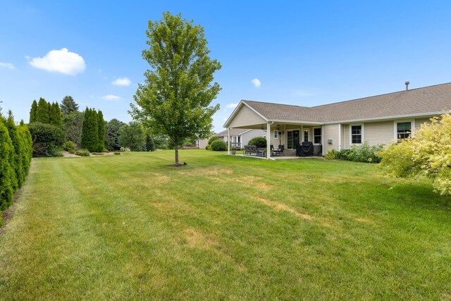 3792 Foxglove Ln, Winnebago, IL 61088 - view of green lawn with a patio area