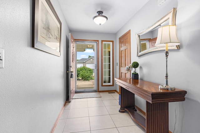 3792 Foxglove Ln, Winnebago, IL 61088 - entryway with baseboards and light tile patterned floors