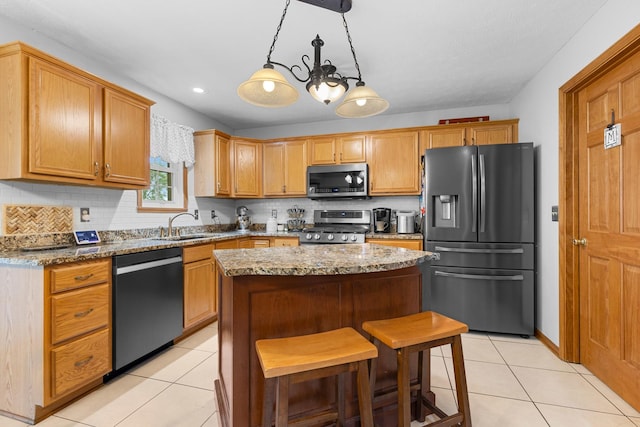 3792 Foxglove Ln, Winnebago, IL 61088 - kitchen featuring stainless steel appliances, a kitchen island, light tile patterned floors, light stone counters, and recessed lighting