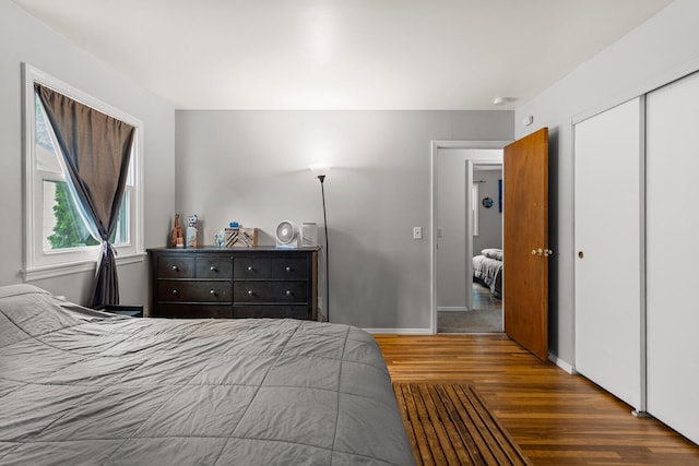 2305 Glenoak Dr, Champaign, IL 61821 - bedroom featuring wood finished floors and a closet