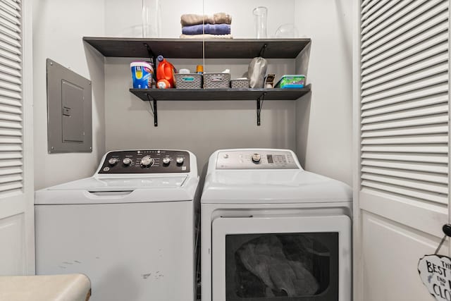 2305 Glenoak Dr, Champaign, IL 61821 - laundry area with electric panel and washing machine and dryer