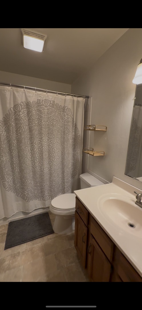 2305 Glenoak Dr, Champaign, IL 61821 - full bathroom with vanity and a shower with curtain