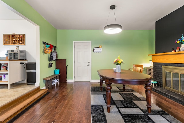 2305 Glenoak Dr, Champaign, IL 61821 - dining area with wood finished floors and a glass covered fireplace