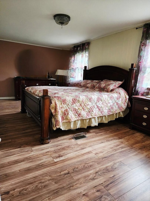 94 E Lakeview Ave, Round Lake Beach, IL 60073 - bedroom featuring wood finished floors and crown molding