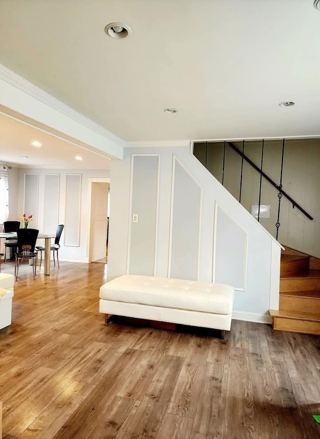 94 E Lakeview Ave, Round Lake Beach, IL 60073 - stairs with wood finished floors, a decorative wall, recessed lighting, and crown molding