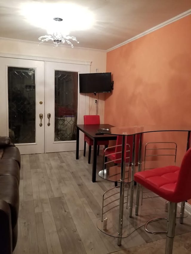 94 E Lakeview Ave, Round Lake Beach, IL 60073 - dining space with ornamental molding, wood finished floors, french doors, and a chandelier