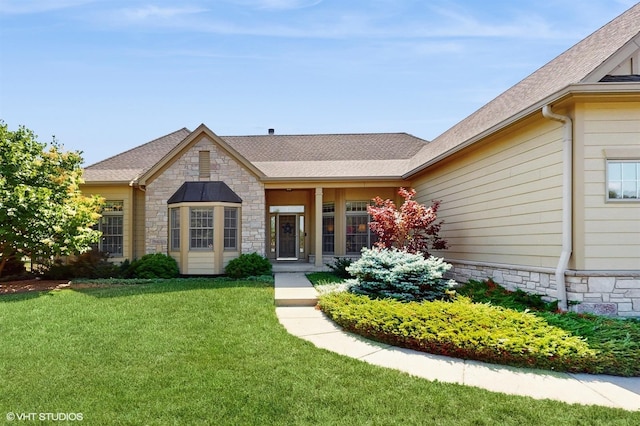 870 Legacy Rdg, Algonquin, IL 60102 - view of front of house featuring stone siding, a front yard, and roof with shingles