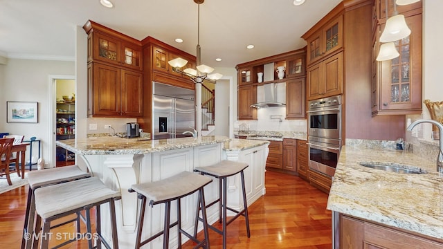 870 Legacy Rdg, Algonquin, IL 60102 - kitchen with appliances with stainless steel finishes, brown cabinets, light wood-type flooring, decorative backsplash, and recessed lighting