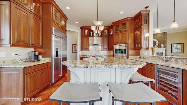 870 Legacy Rdg, Algonquin, IL 60102 - kitchen with beverage cooler, stainless steel appliances, wood finished floors, a center island with sink, and recessed lighting