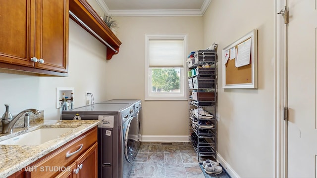 870 Legacy Rdg, Algonquin, IL 60102 - laundry room featuring separate washer and dryer, cabinet space, ornamental molding, and stone finish flooring