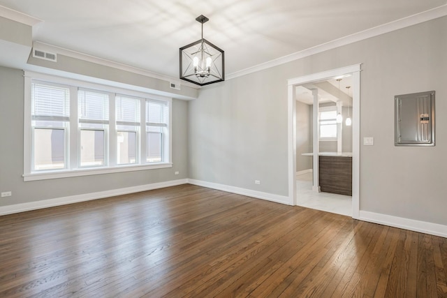1535 W Estes Ave Unit 4, Chicago, IL 60626 - spare room featuring electric panel, wood-type flooring, ornamental molding, a chandelier, and healthy amount of natural light