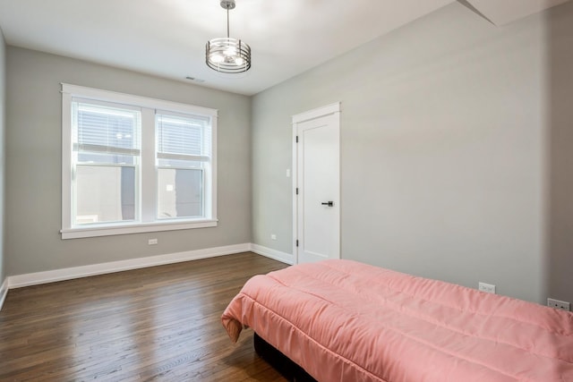 1535 W Estes Ave Unit 4, Chicago, IL 60626 - bedroom with baseboards and dark wood-type flooring