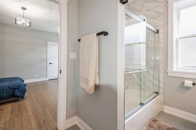 1535 W Estes Ave Unit 4, Chicago, IL 60626 - full bathroom featuring enclosed tub / shower combo and wood finished floors