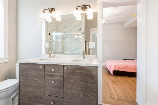 1535 W Estes Ave Unit 4, Chicago, IL 60626 - bathroom with double vanity, a shower stall, and wood finished floors