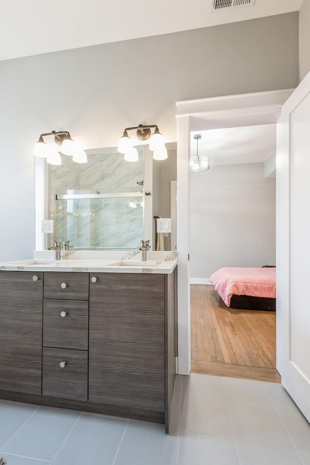 1535 W Estes Ave Unit 4, Chicago, IL 60626 - full bath featuring double vanity, a stall shower, tile patterned flooring, and ensuite bath