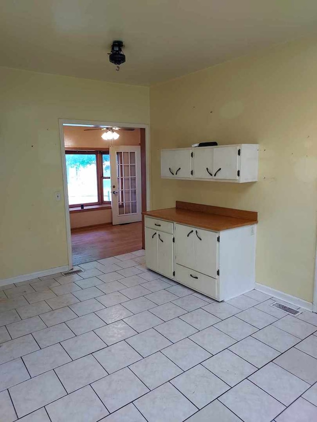 501 S Spruce St, Villa Grove, IL 61956 - spare room with french doors, ceiling fan, and light tile patterned flooring