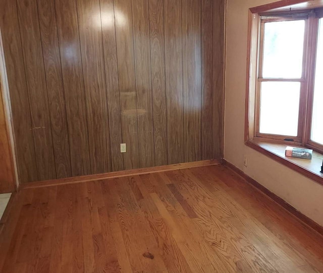 501 S Spruce St, Villa Grove, IL 61956 - spare room featuring wood finished floors and plenty of natural light