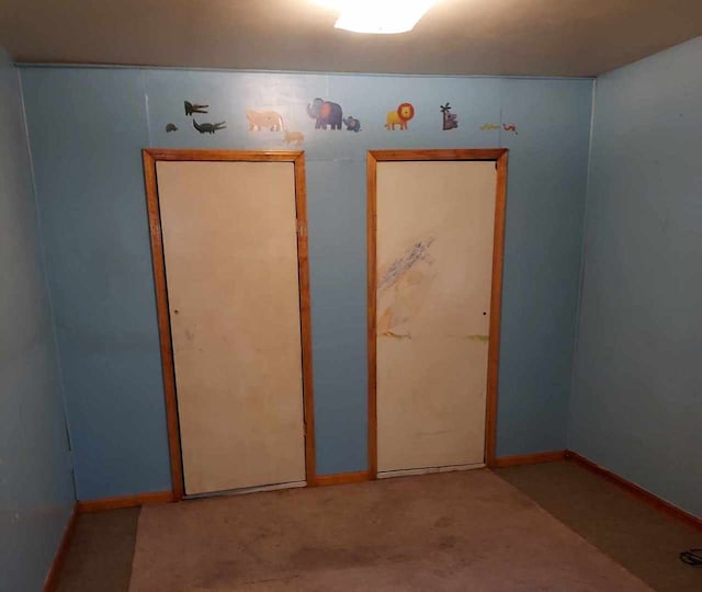 501 S Spruce St, Villa Grove, IL 61956 - unfurnished bedroom with baseboards and carpet floors