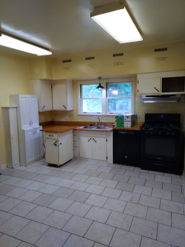501 S Spruce St, Villa Grove, IL 61956 - kitchen featuring black appliances, white cabinetry, under cabinet range hood, and light tile patterned floors