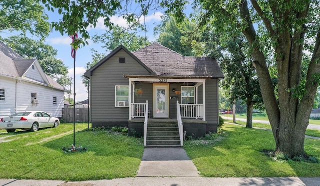 201 N Sycamore St, Villa Grove, IL 61956 - bungalow with a porch and a front yard