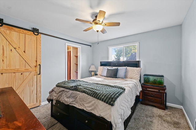 201 N Sycamore St, Villa Grove, IL 61956 - bedroom with light carpet, ceiling fan, and a barn door