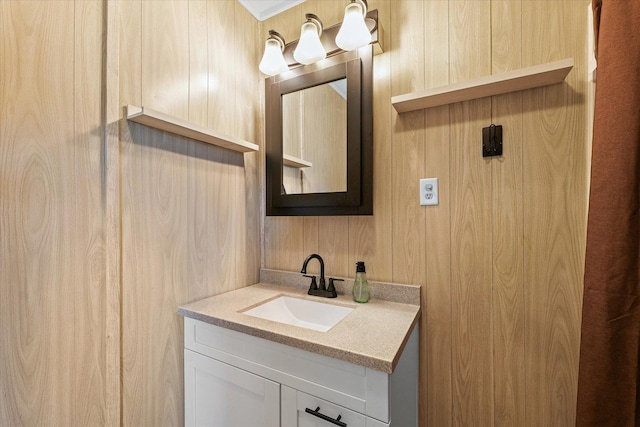 201 N Sycamore St, Villa Grove, IL 61956 - bathroom with vanity and wood walls