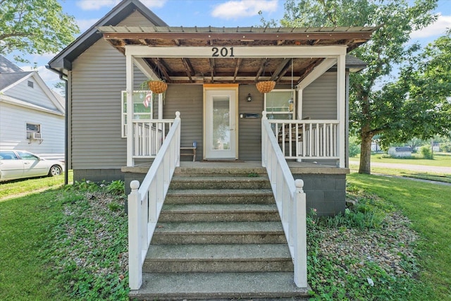 201 N Sycamore St, Villa Grove, IL 61956 - view of front facade with a front lawn and covered porch