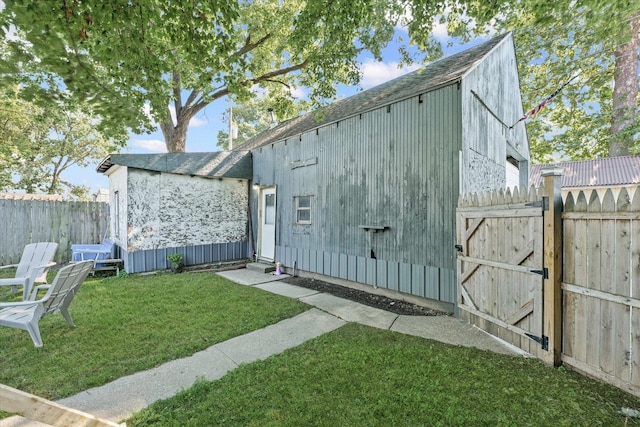 201 N Sycamore St, Villa Grove, IL 61956 - rear view of house featuring a gate and entry steps