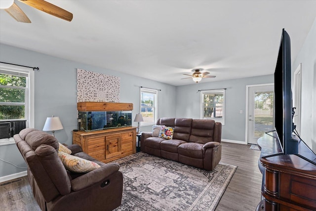 201 N Sycamore St, Villa Grove, IL 61956 - living room with ceiling fan, plenty of natural light, and wood finished floors