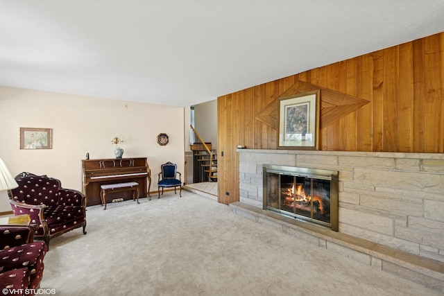 1142 N Perry Dr, Palatine, IL 60067 - living room with stairs, carpet flooring, wood walls, and a fireplace