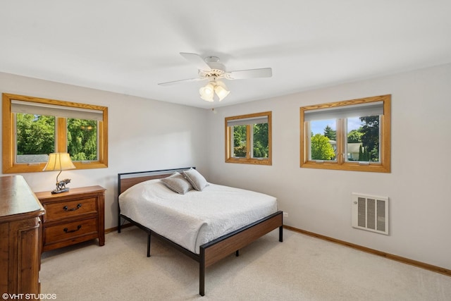 1142 N Perry Dr, Palatine, IL 60067 - bedroom with light colored carpet and a ceiling fan