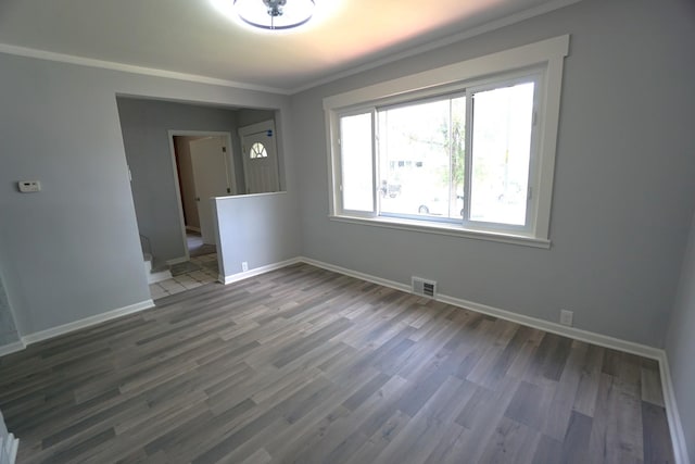 2524 N Mont Clare Ave, Chicago, IL 60707 - spare room featuring ornamental molding and wood finished floors