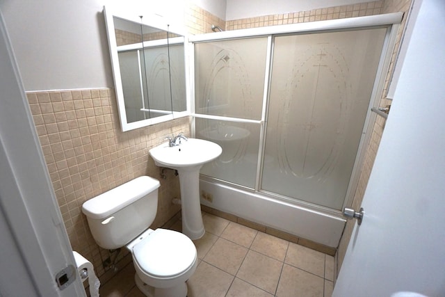 2524 N Mont Clare Ave, Chicago, IL 60707 - full bath featuring tile walls, tile patterned flooring, and bath / shower combo with glass door