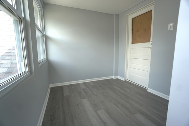 2524 N Mont Clare Ave, Chicago, IL 60707 - unfurnished room with dark wood-style floors and baseboards