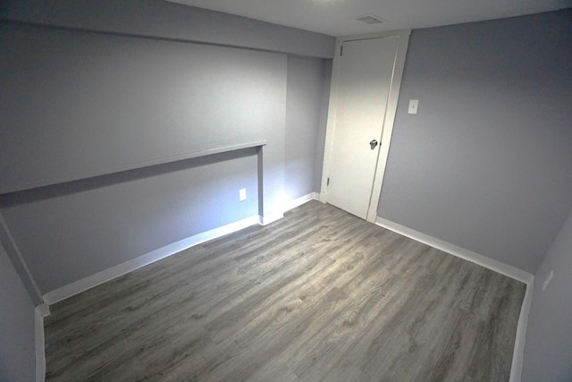 2524 N Mont Clare Ave, Chicago, IL 60707 - spare room with dark wood-type flooring and baseboards