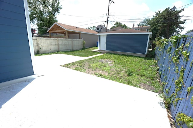 2524 N Mont Clare Ave, Chicago, IL 60707 - fenced backyard featuring a patio and a storage shed