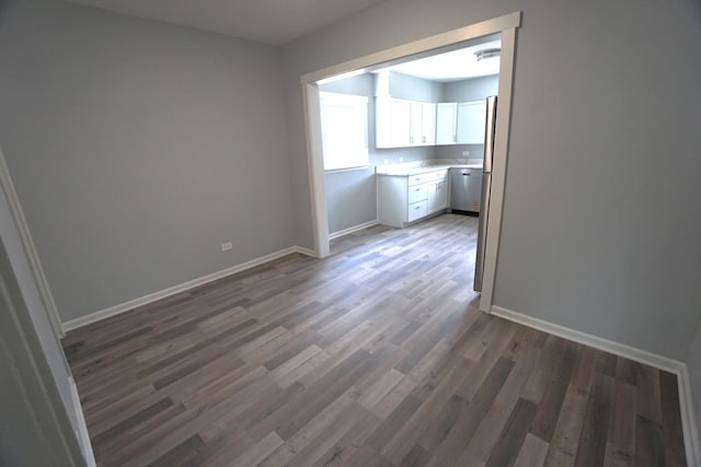 2524 N Mont Clare Ave, Chicago, IL 60707 - spare room with baseboards and wood finished floors