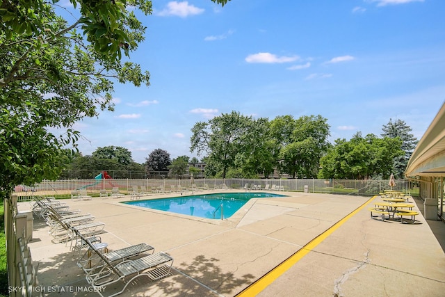 128 E Bailey Rd Unit G, Naperville, IL 60565 - community pool featuring a patio and view of scattered trees