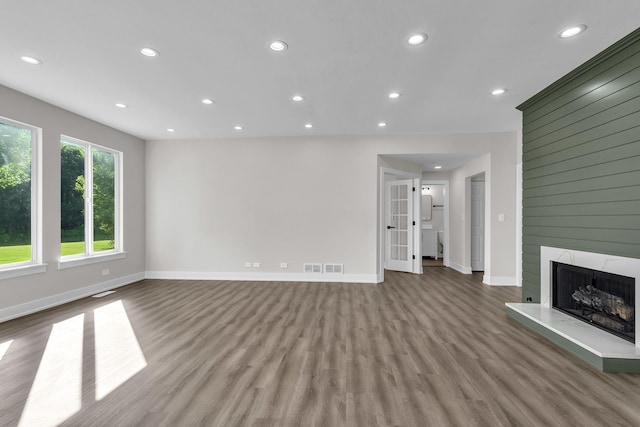 2054 S Jonathan Dr, Round Lake, IL 60073 - unfurnished living room featuring wood finished floors, recessed lighting, and a fireplace