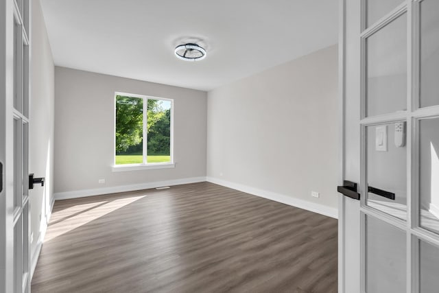 2054 S Jonathan Dr, Round Lake, IL 60073 - spare room with dark wood finished floors and baseboards