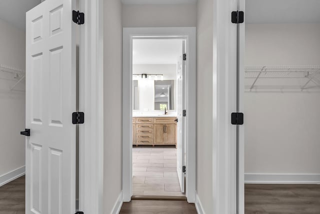 2054 S Jonathan Dr, Round Lake, IL 60073 - corridor featuring wood finished floors and a sink