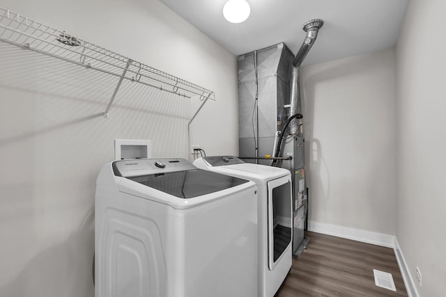2054 S Jonathan Dr, Round Lake, IL 60073 - laundry area featuring washing machine and clothes dryer and dark wood-style floors