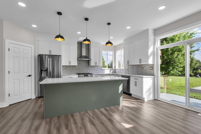 2054 S Jonathan Dr, Round Lake, IL 60073 - kitchen featuring stainless steel appliances, plenty of natural light, a center island, dark wood-style floors, and recessed lighting